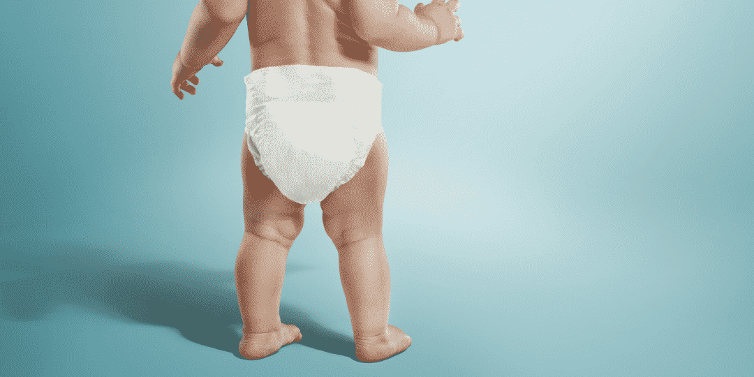 baby standing in diaper