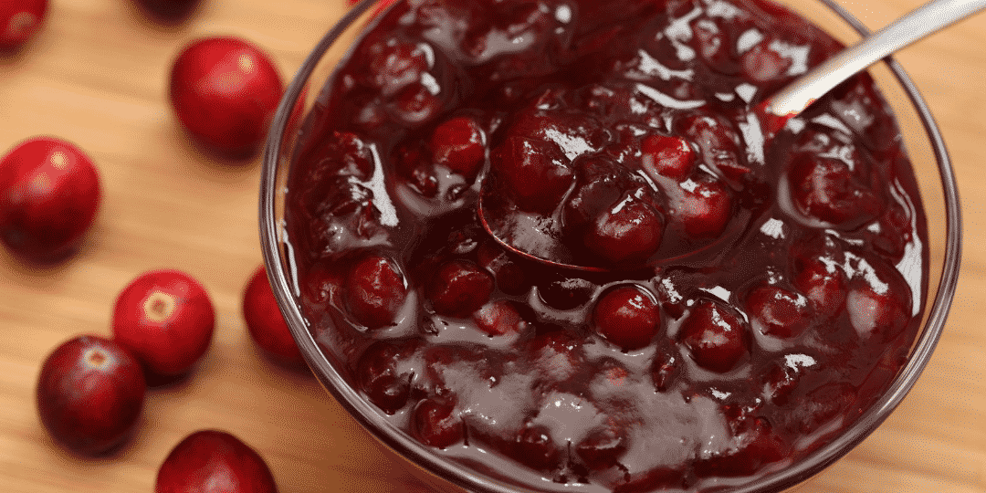 cranberry sauce with cranberries on the table in the backgrounds