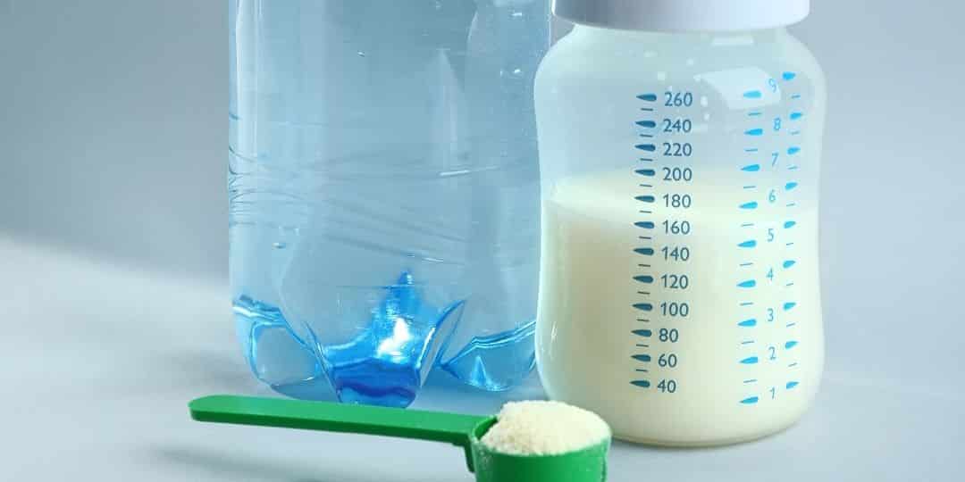 water and infant formula with a bottle