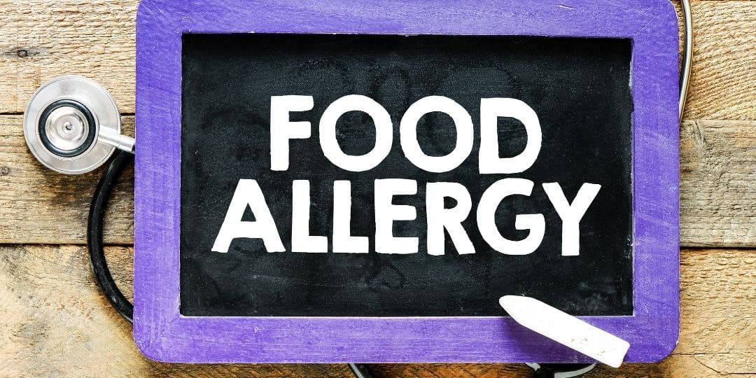 Food allergy written on chalkboard
