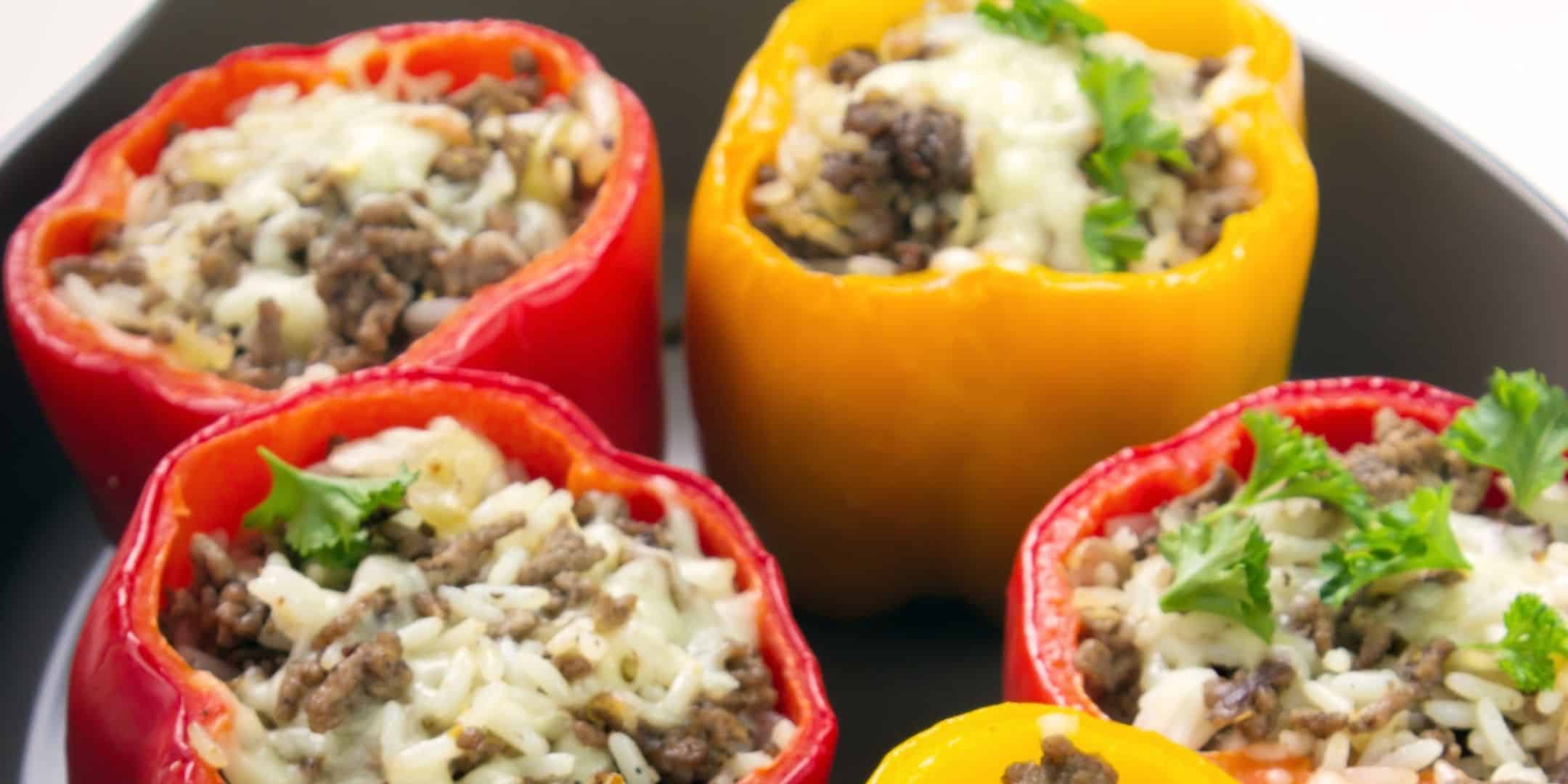 stuffed bell pepper for baby with rice cheese and meat in a cast iron pan