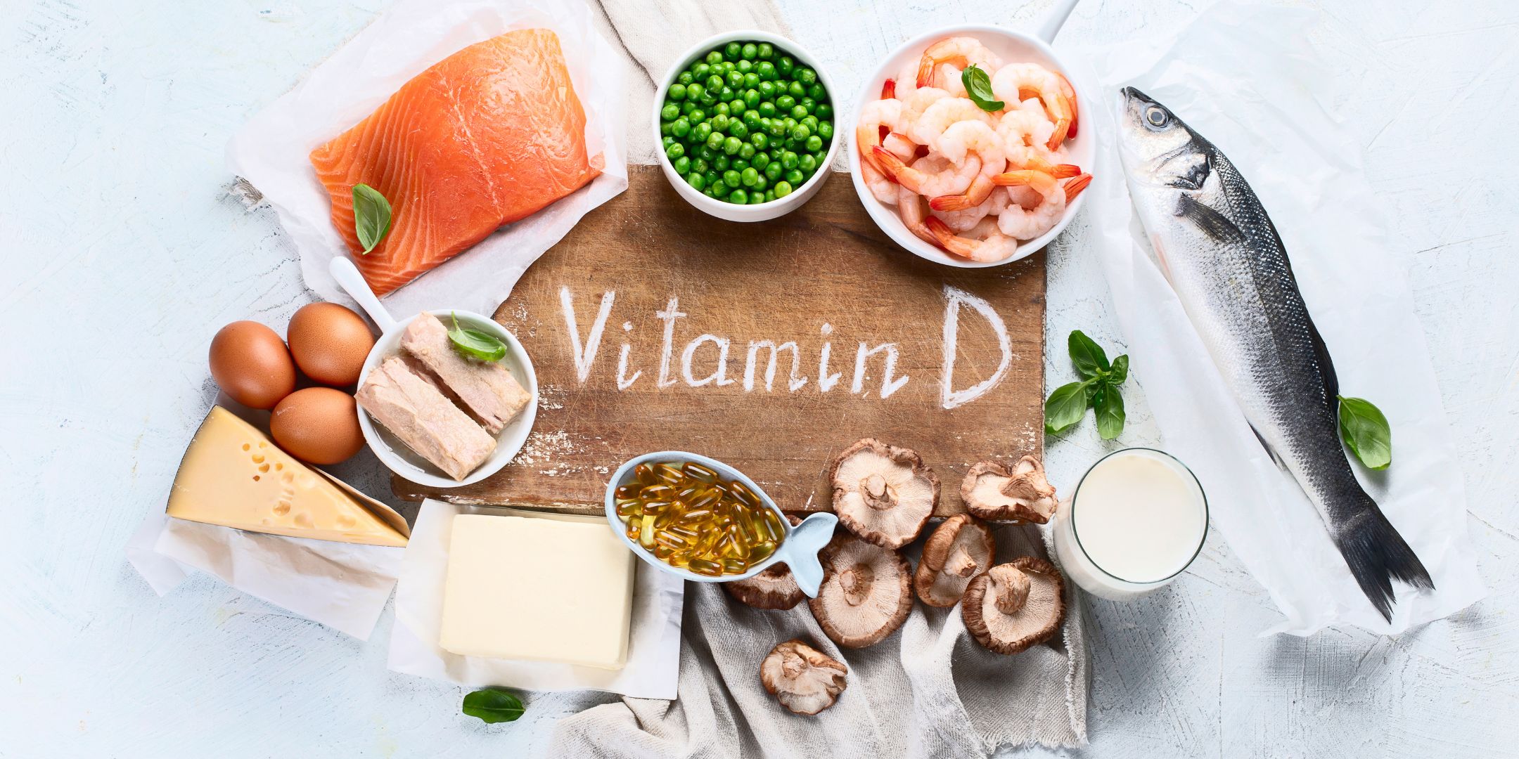 vitamin D sign surrounded by foods that contain vitamin D