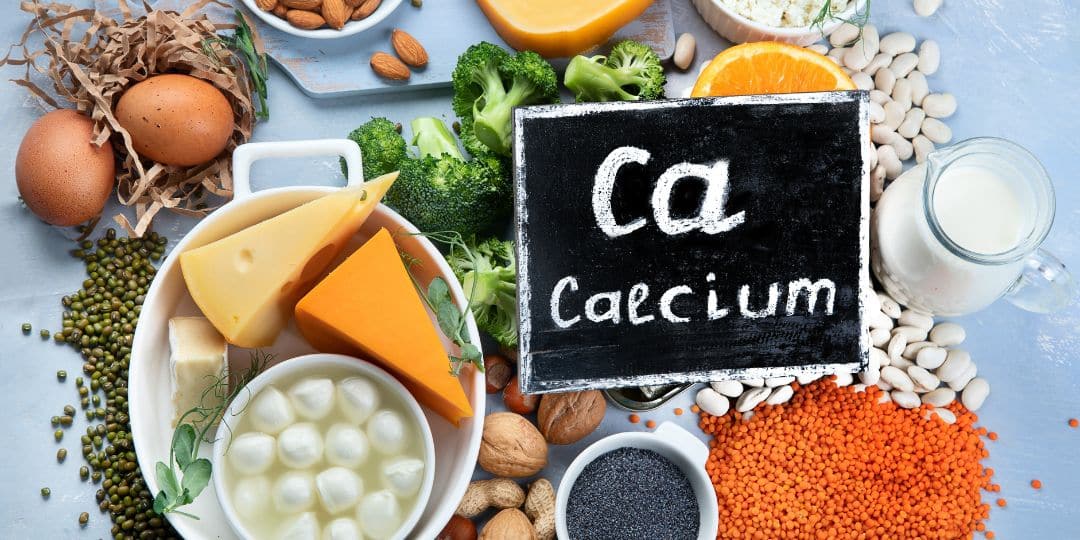chalkboard with " ca calcium" surrounded by calcium containing foods
