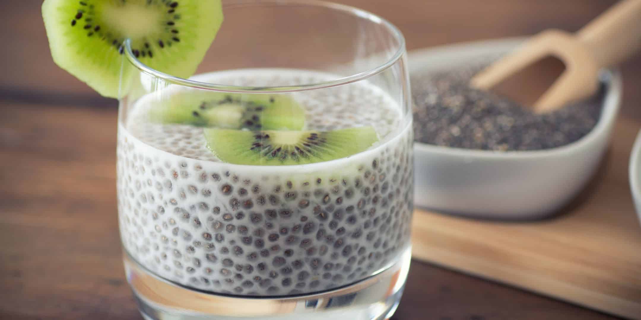 chia pudding with kiwi and chia seeds in background