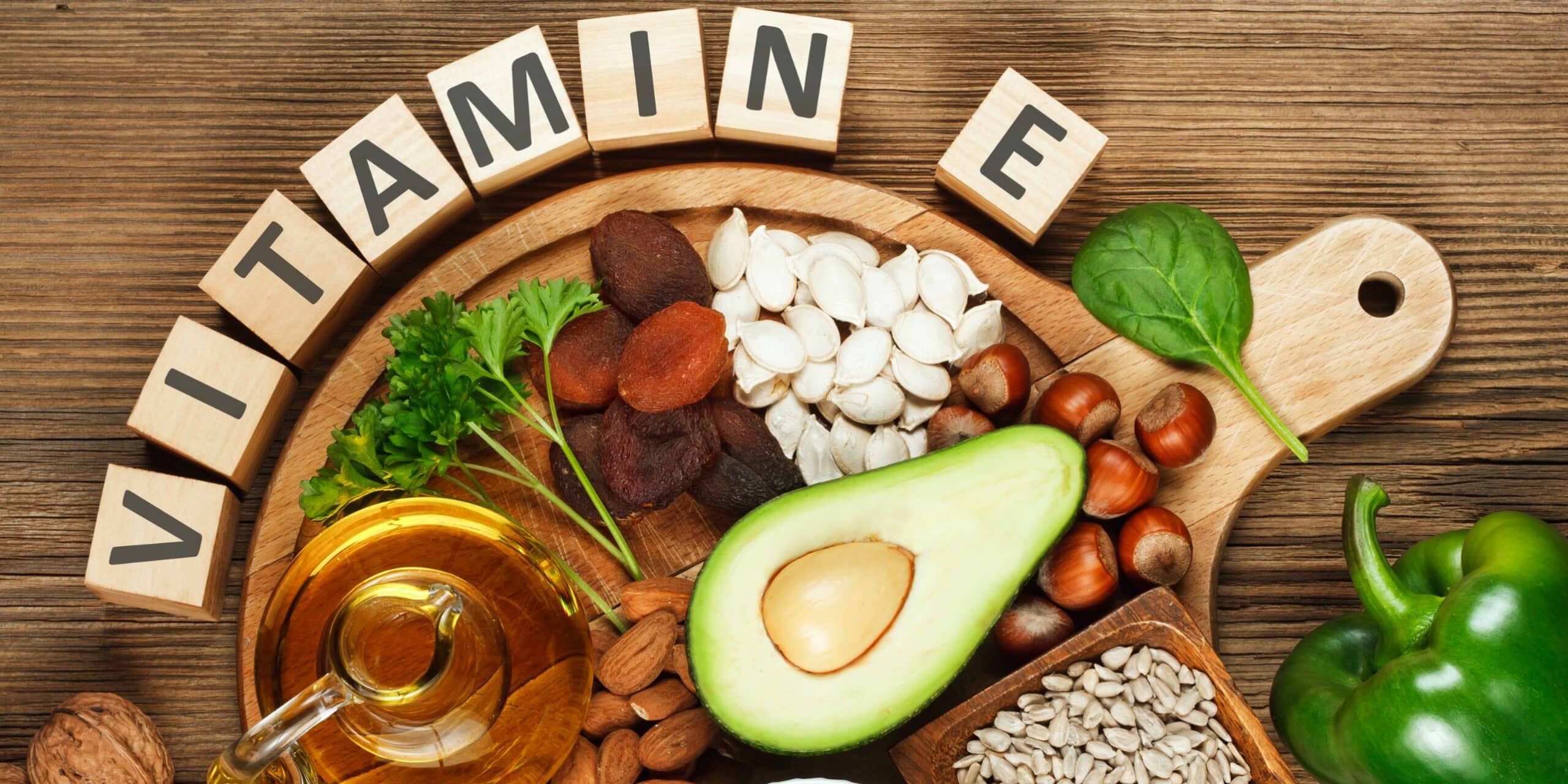 blocks spelling out vitamin E with foods that contain vitamin E
